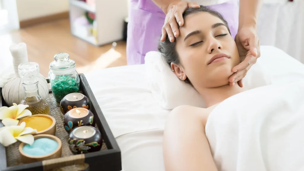 Panchakarma treatment procedure with relaxing Ayurvedic head massage therapy in a luxury wellness spa setting